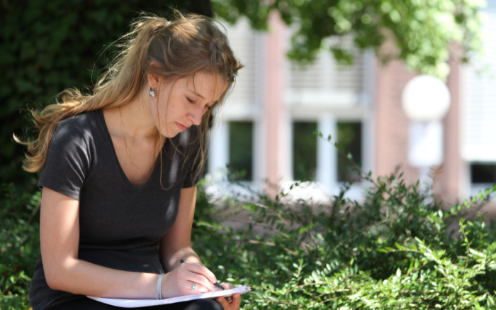 Girl sitting and writting